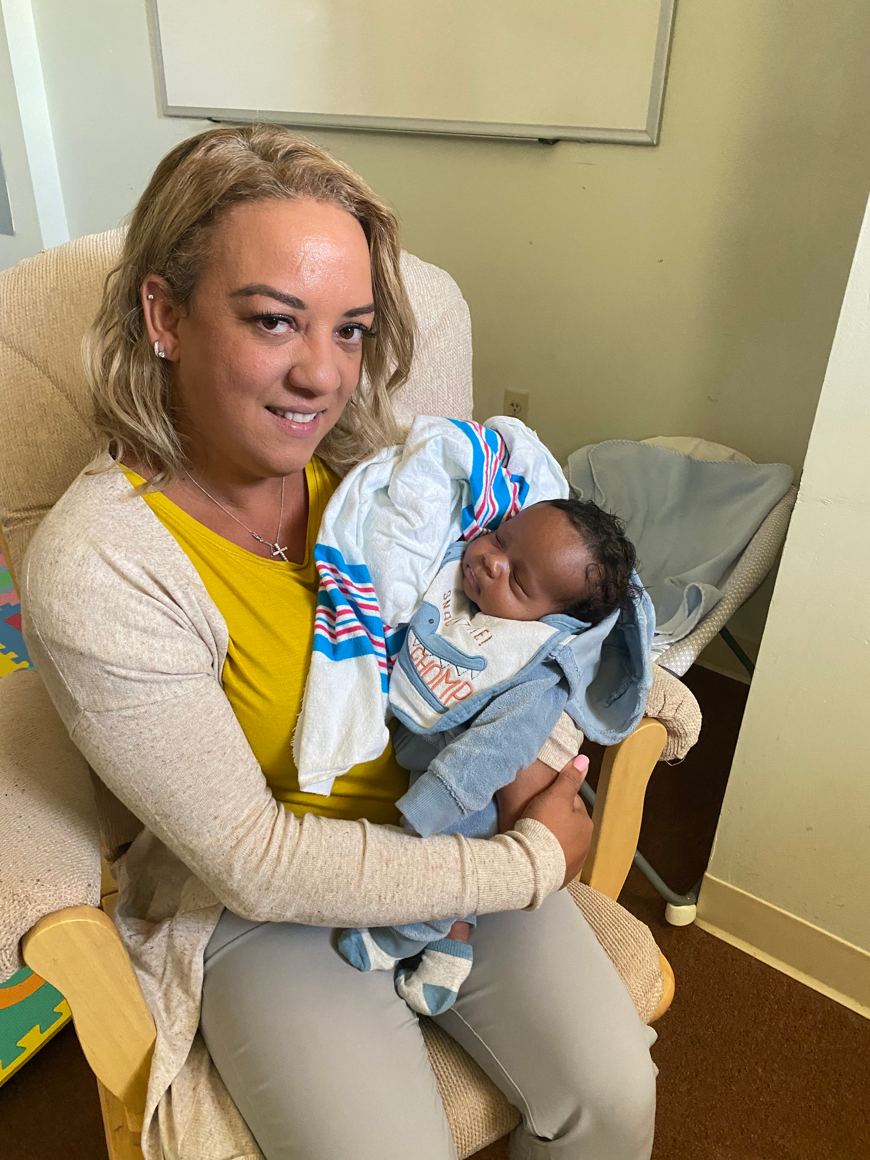 Lisa Merritt holding an infant